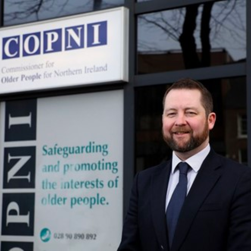 Commissioner Eddie poses outside the COPNI office